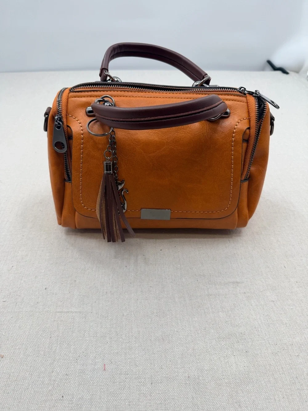 Structured Orange Satchel with Tassel Accent